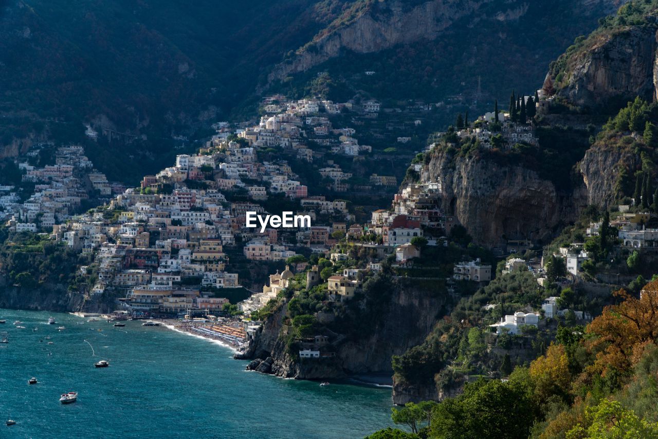 Aerial view of city by sea