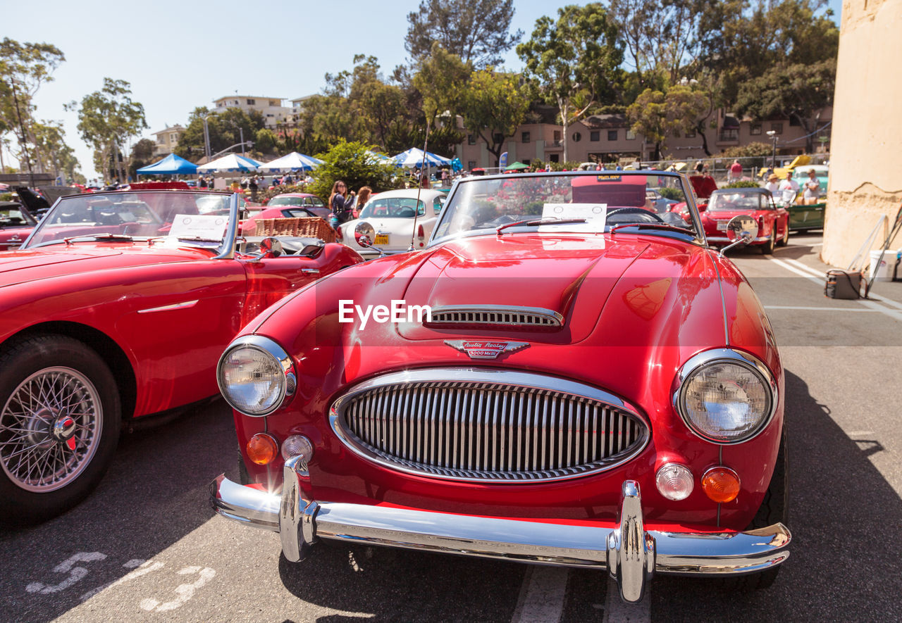 RED VINTAGE CAR ON ROAD