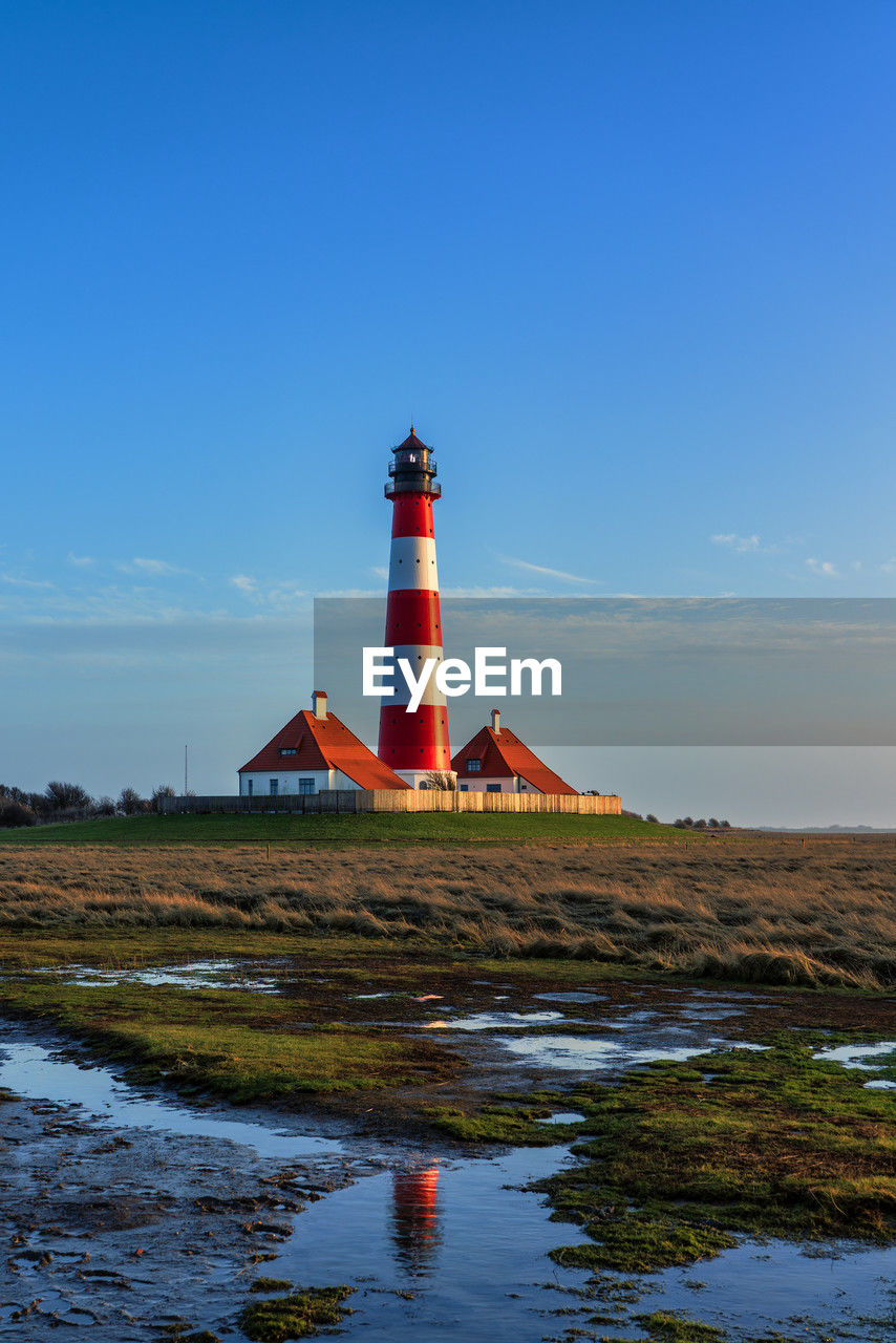 Westerheversand lighthouse on the north sea a landmark of the eiderstedt peninsula in germany.