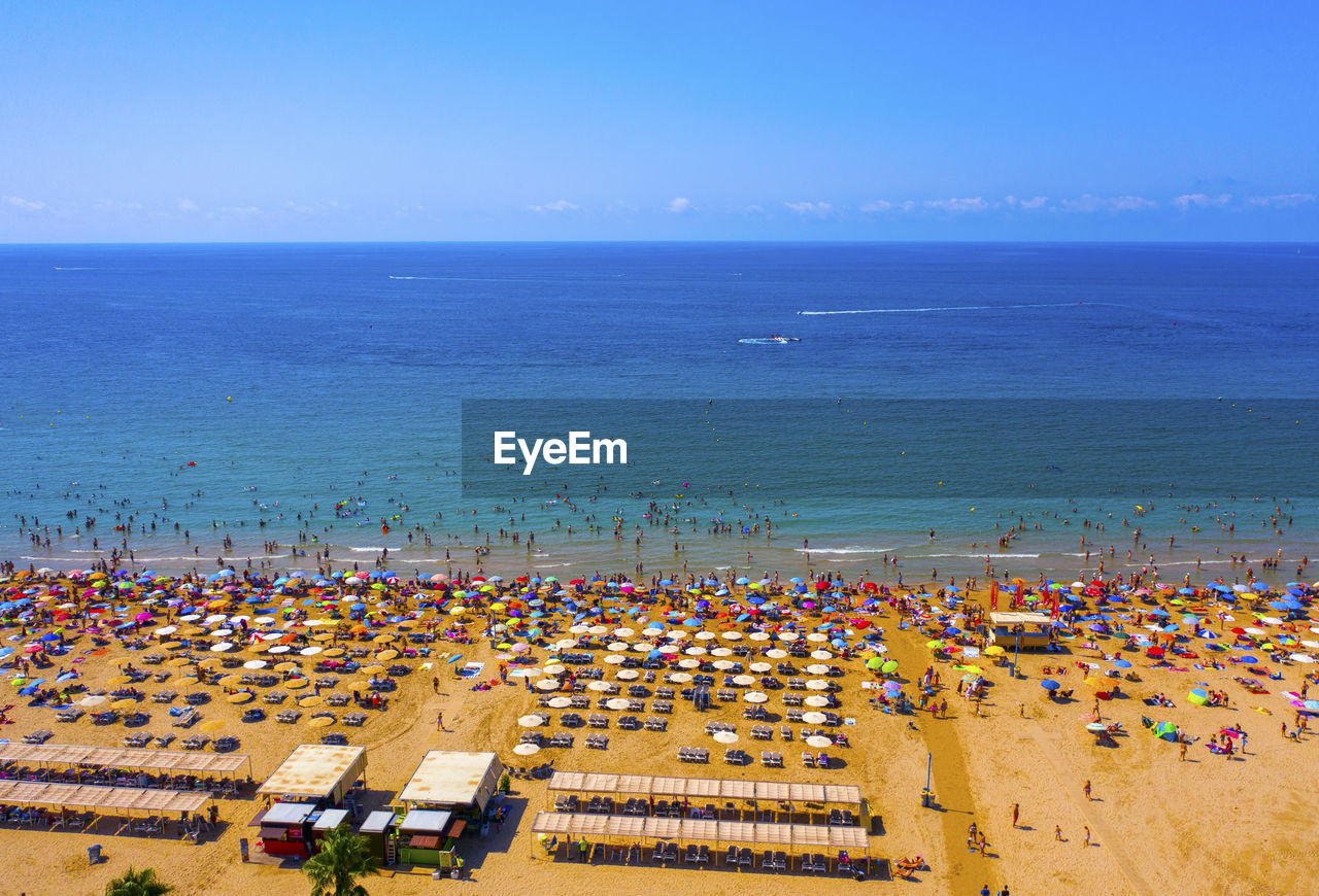 HIGH ANGLE VIEW OF BEACH AGAINST SKY