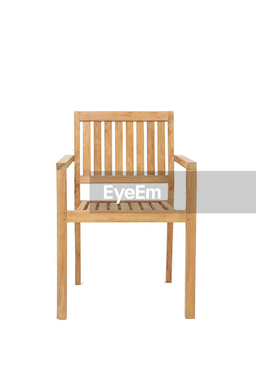 CLOSE-UP OF CHAIRS AGAINST WHITE BACKGROUND