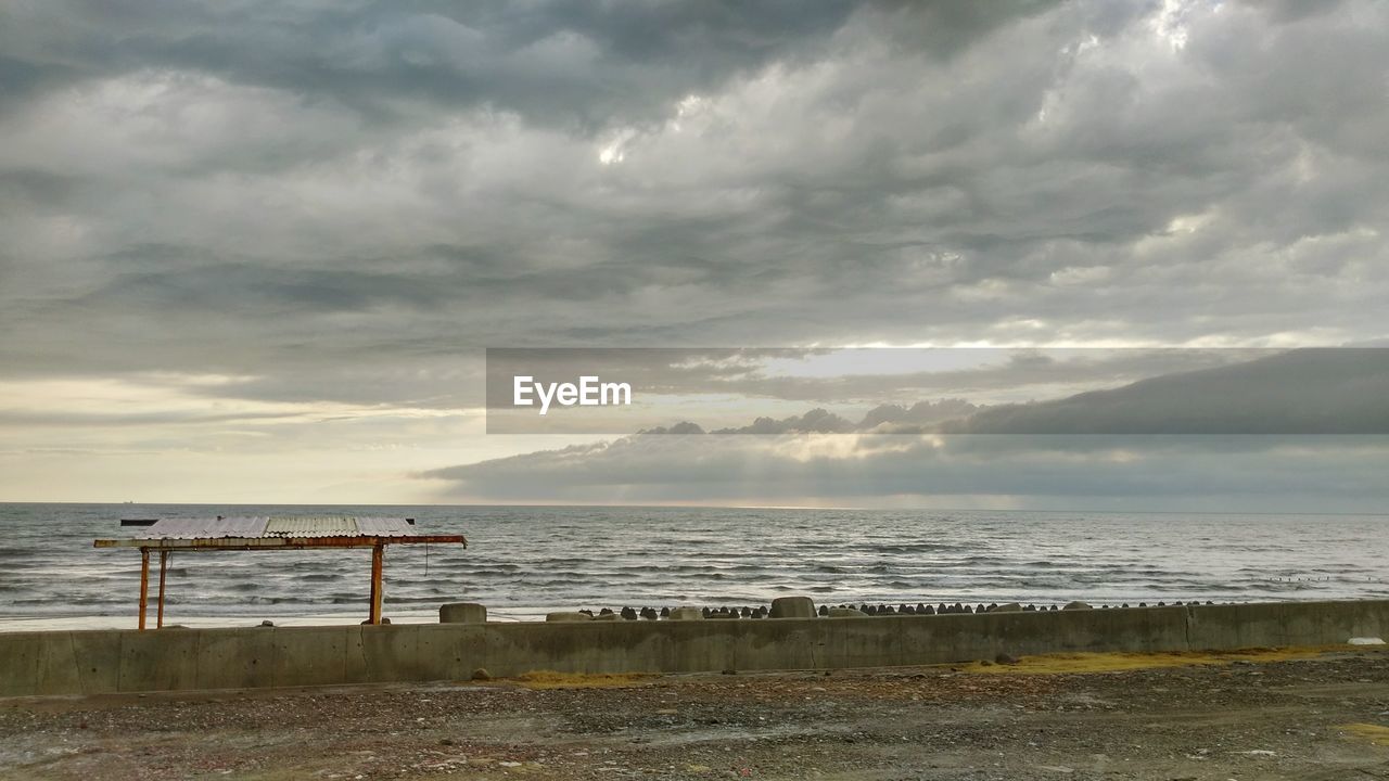 VIEW OF SEA AGAINST CLOUDY SKY