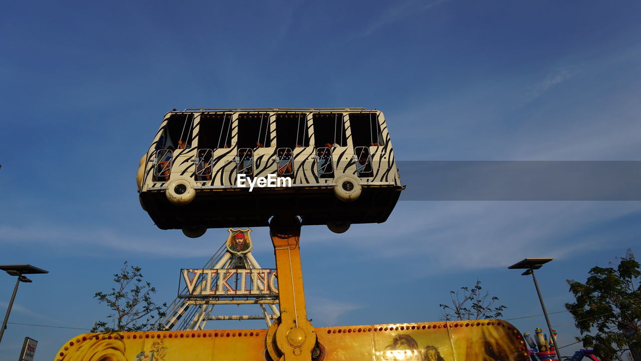 LOW ANGLE VIEW OF ROLLERCOASTER AGAINST SKY