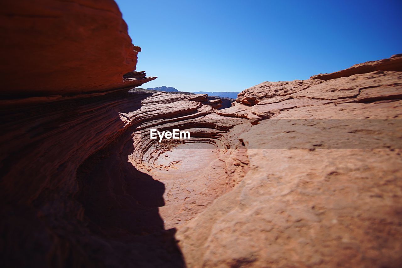 Low angle view of rock formation against clear sky