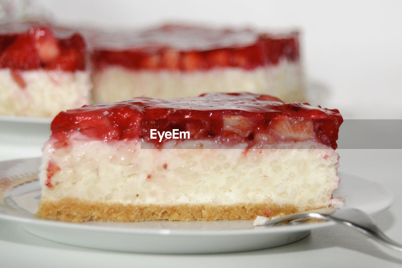 Close-up of strawberry cake in plate on table