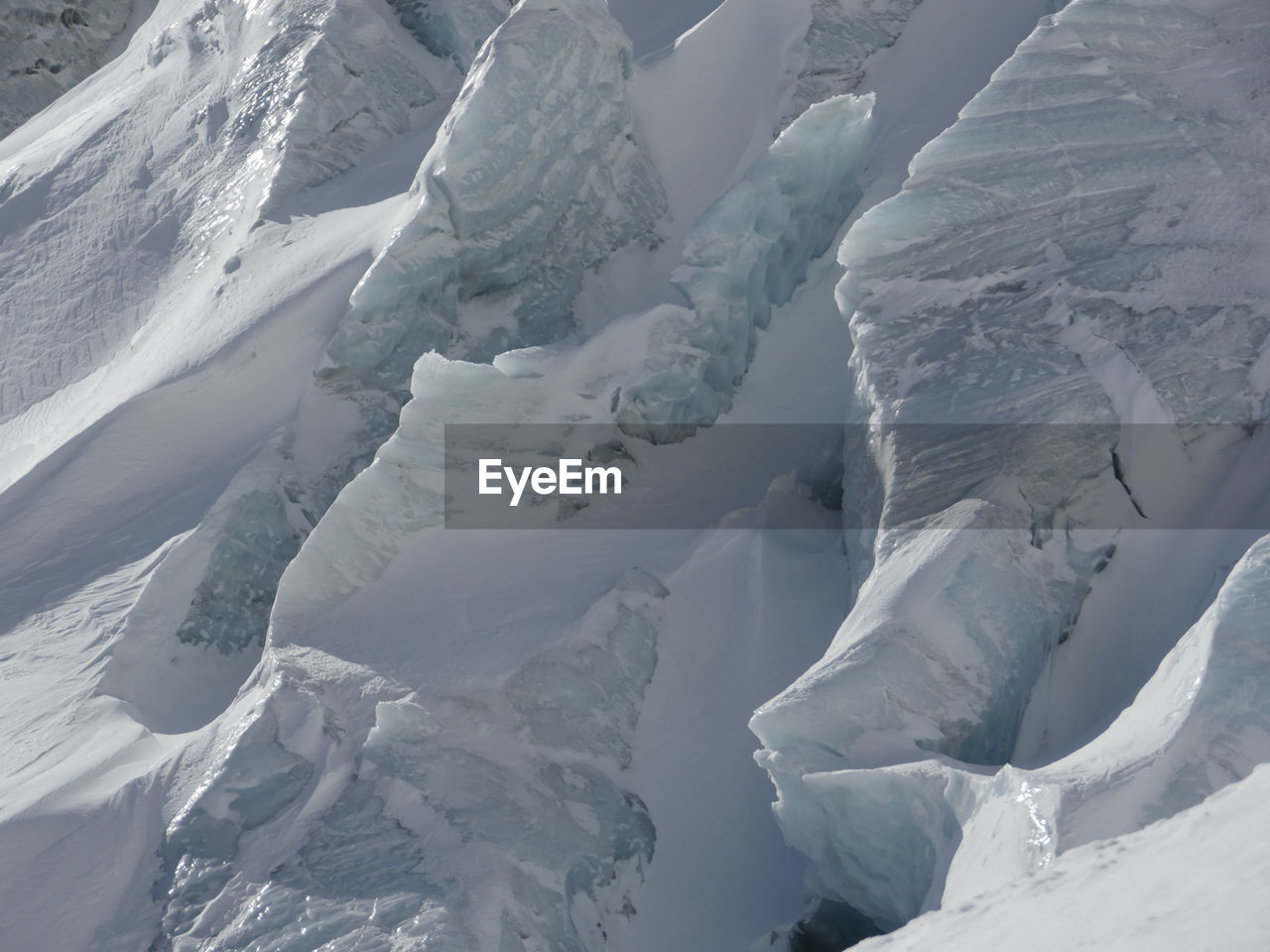 Full frame shot of glaciers on sunny day