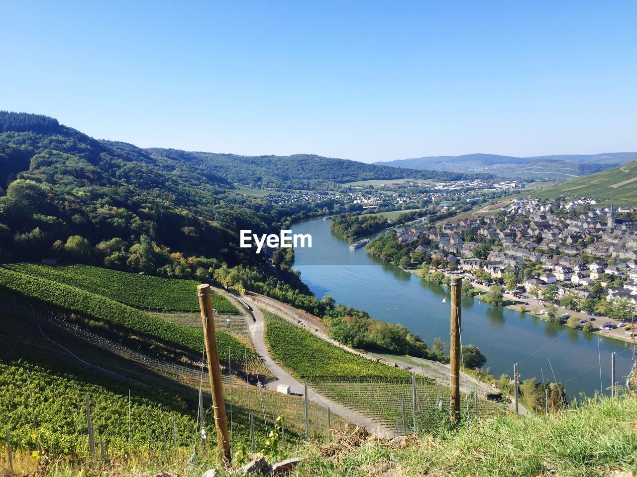 Scenic view of river amidst landscape against clear sky