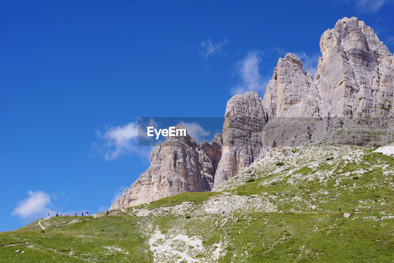 Low angle view of rock formations against sky