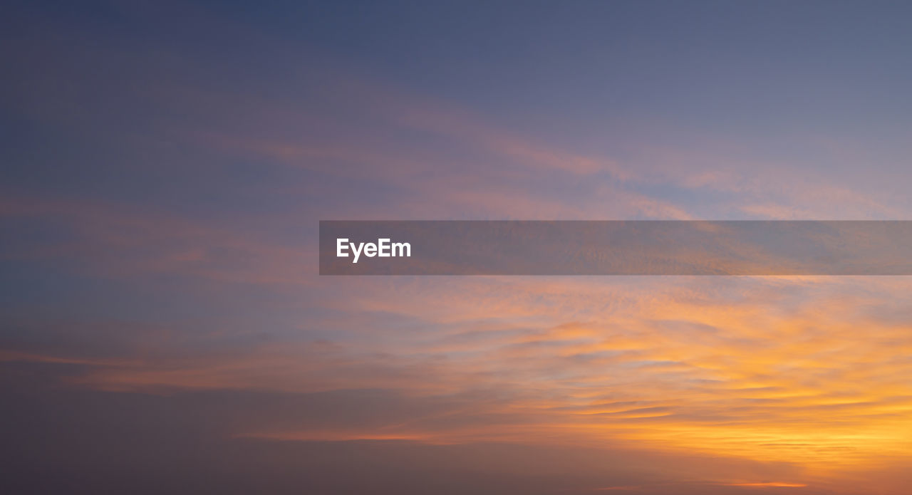 low angle view of clouds in sky during sunset