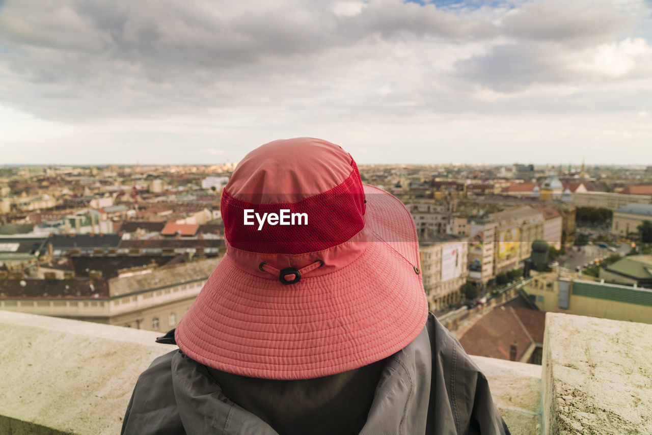 Lady with a hat enjoying view of budapest from st stephen's basilica