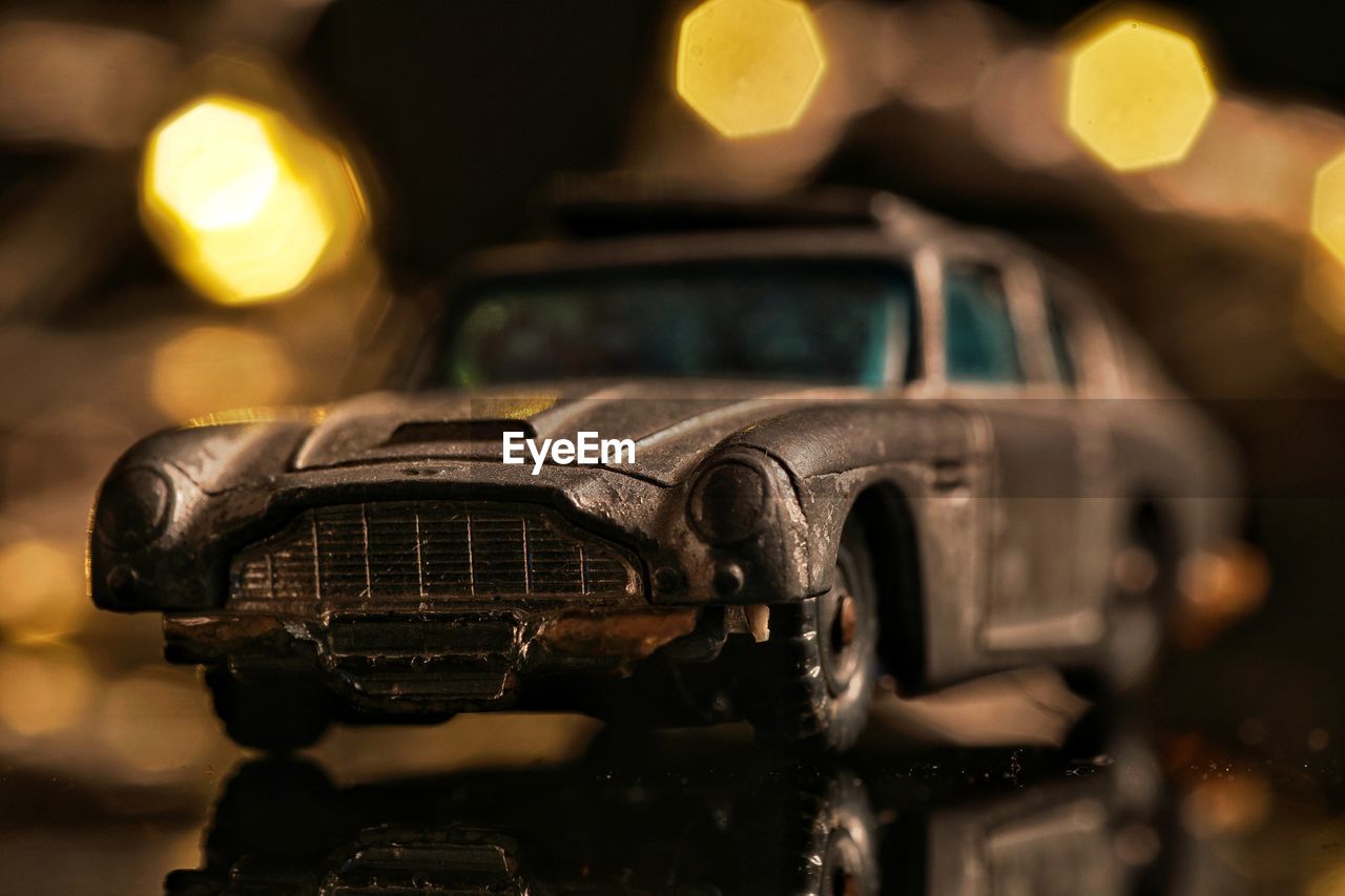 CLOSE-UP OF VINTAGE CAR ON MOTORCYCLE