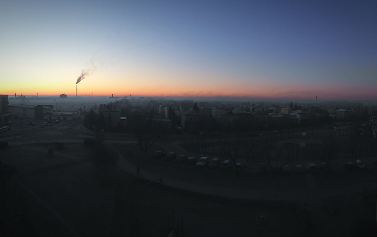 VIEW OF CITYSCAPE AT SUNSET