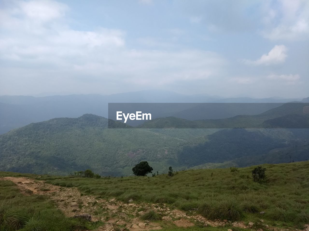 SCENIC VIEW OF MOUNTAIN RANGE AGAINST SKY