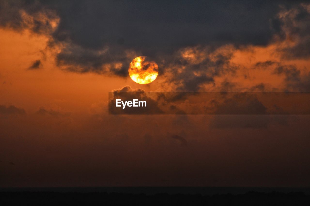 Scenic view of sea against sky at sunset