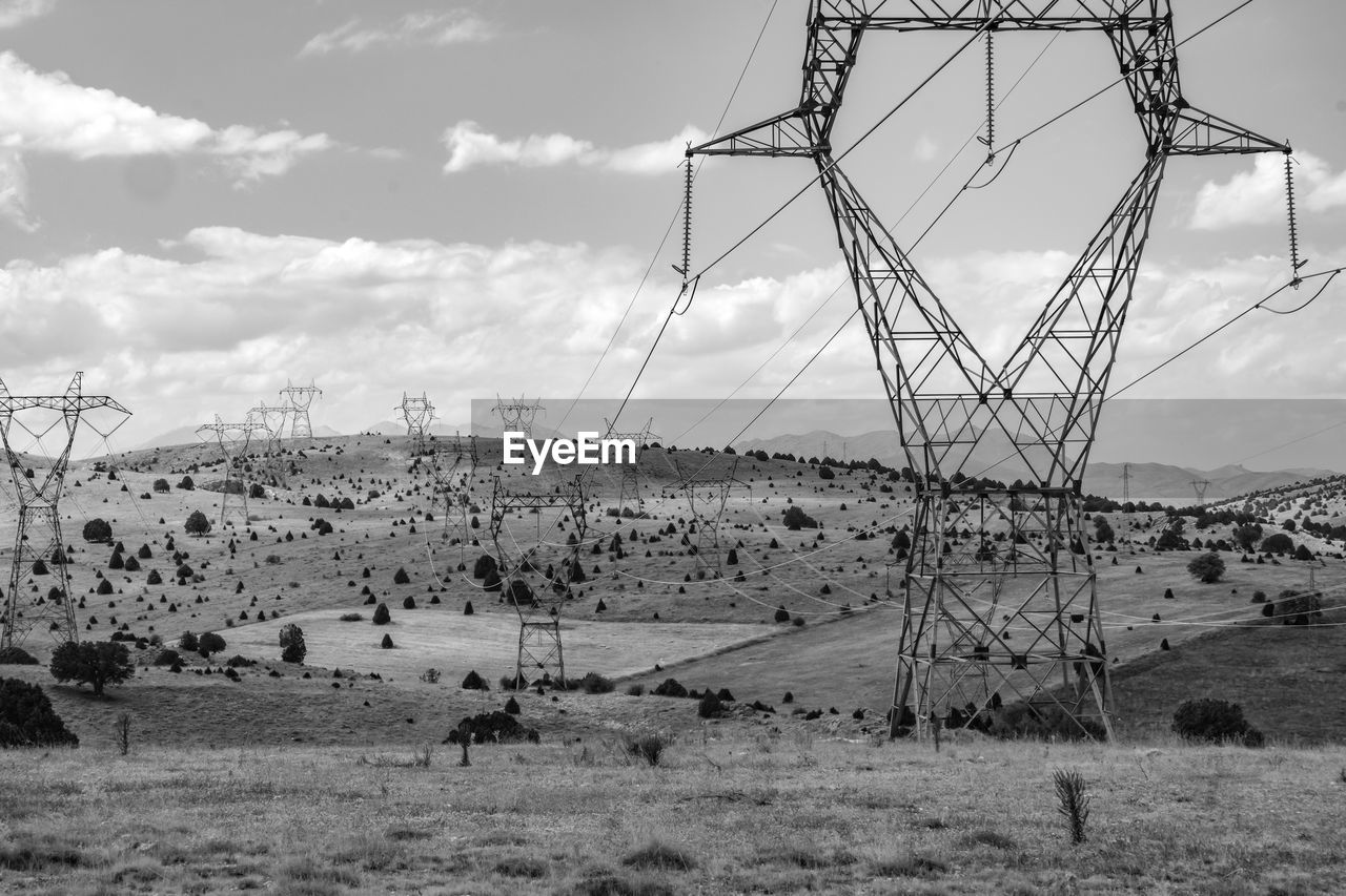 Electricity pylon on field against sky in turkey