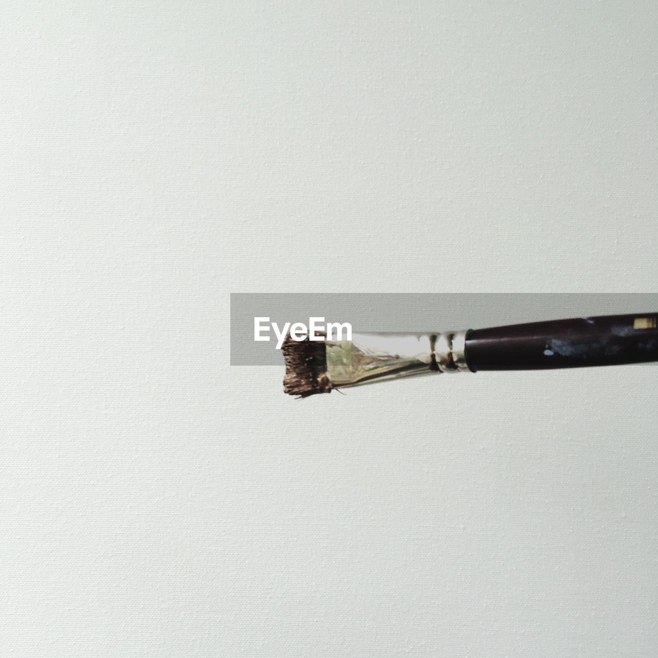 Close-up of paint brush against white background