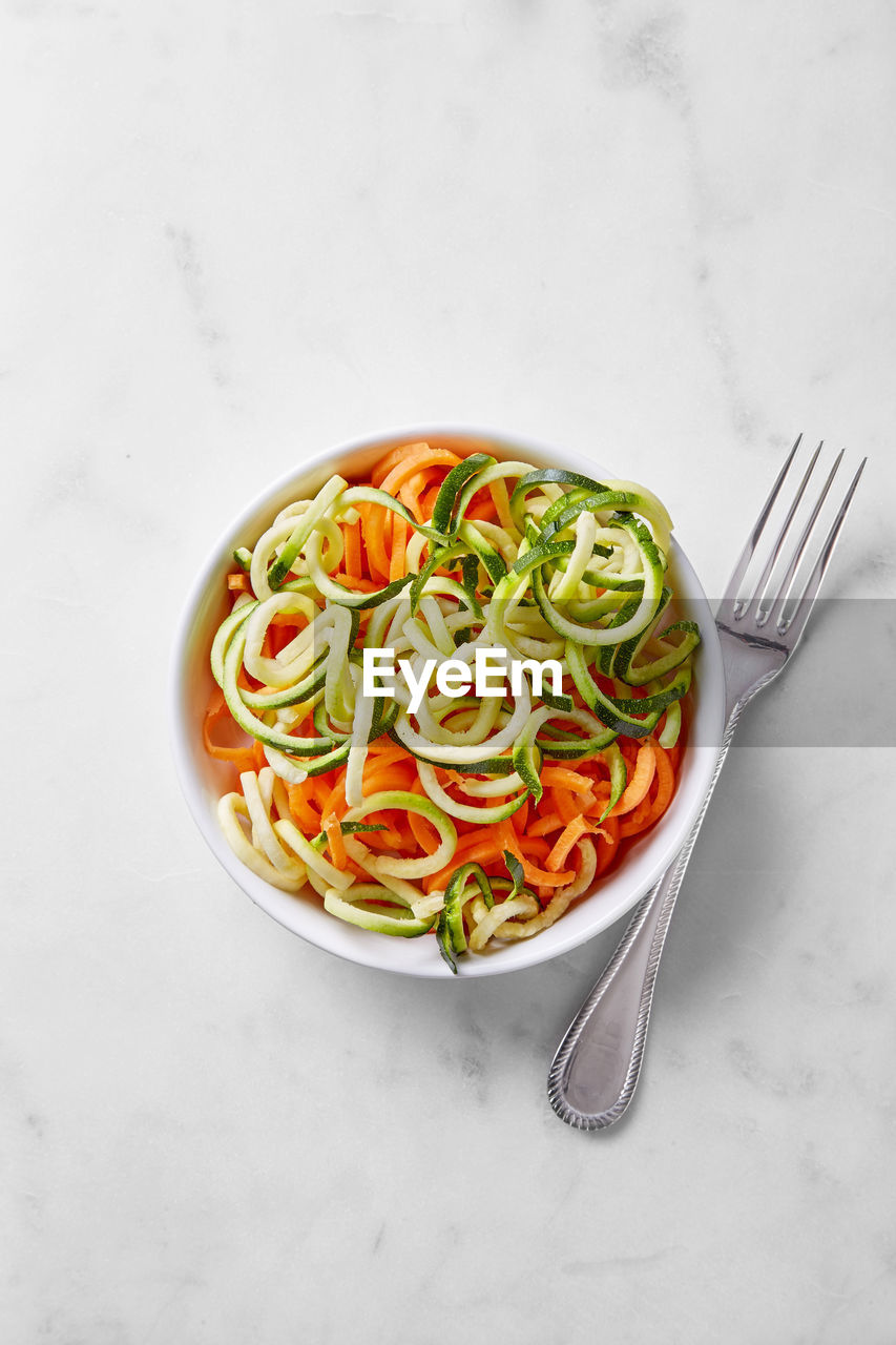 Directly above view of meal served in bowl on marble