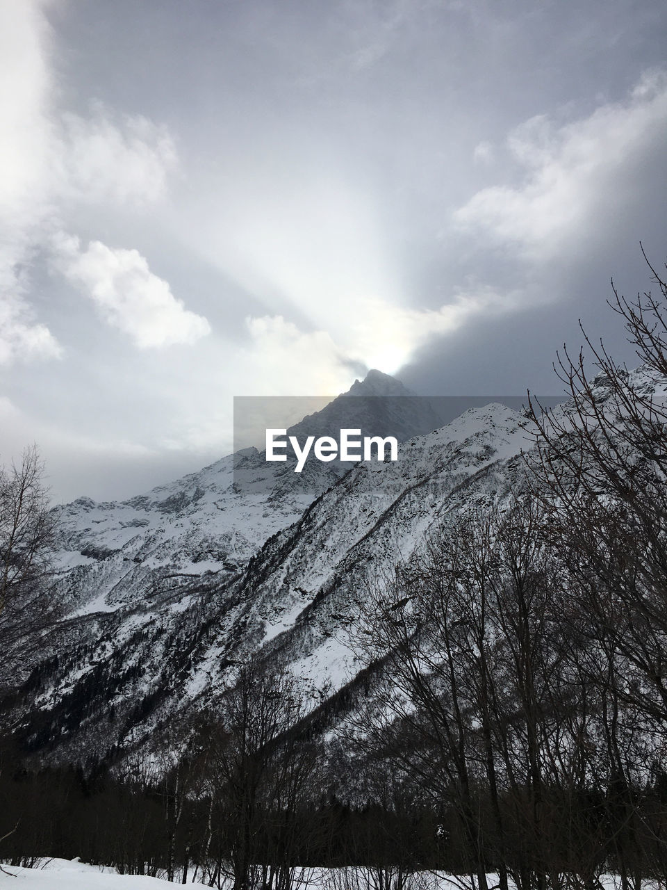 SCENIC VIEW OF MOUNTAINS AGAINST SKY DURING WINTER