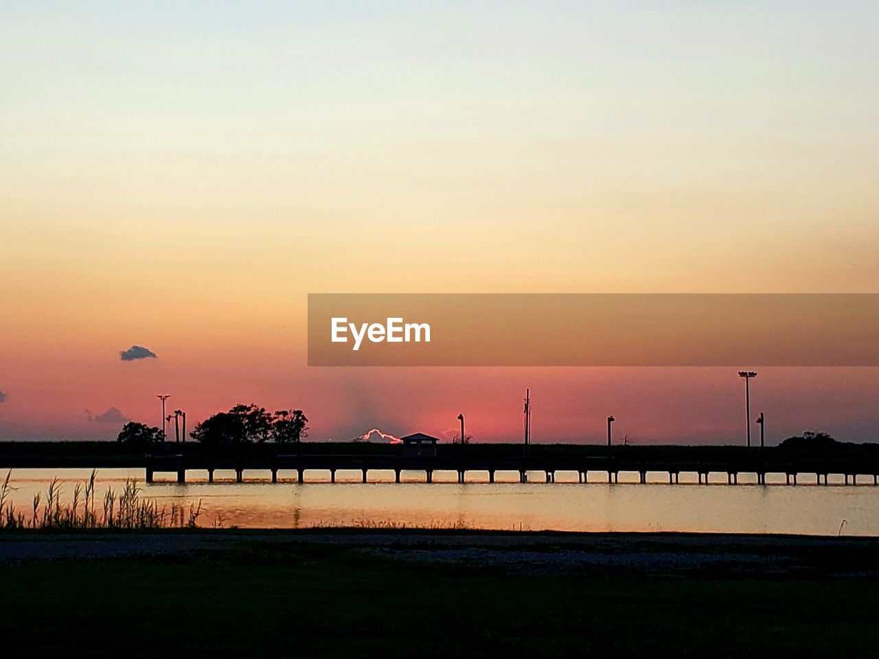 SILHOUETTE BRIDGE AGAINST SKY DURING SUNSET