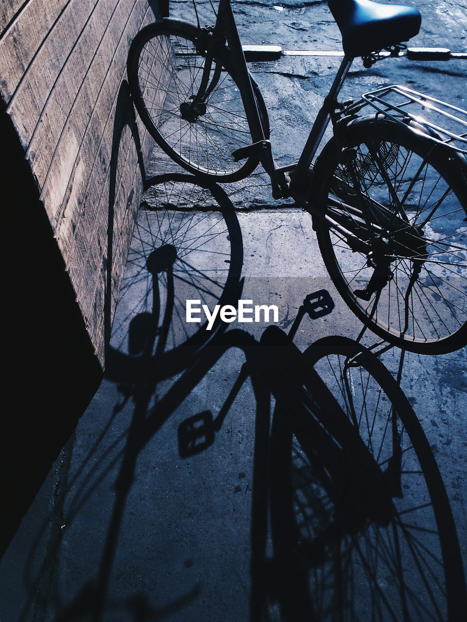 High angle view of bicycle with reflection of puddle
