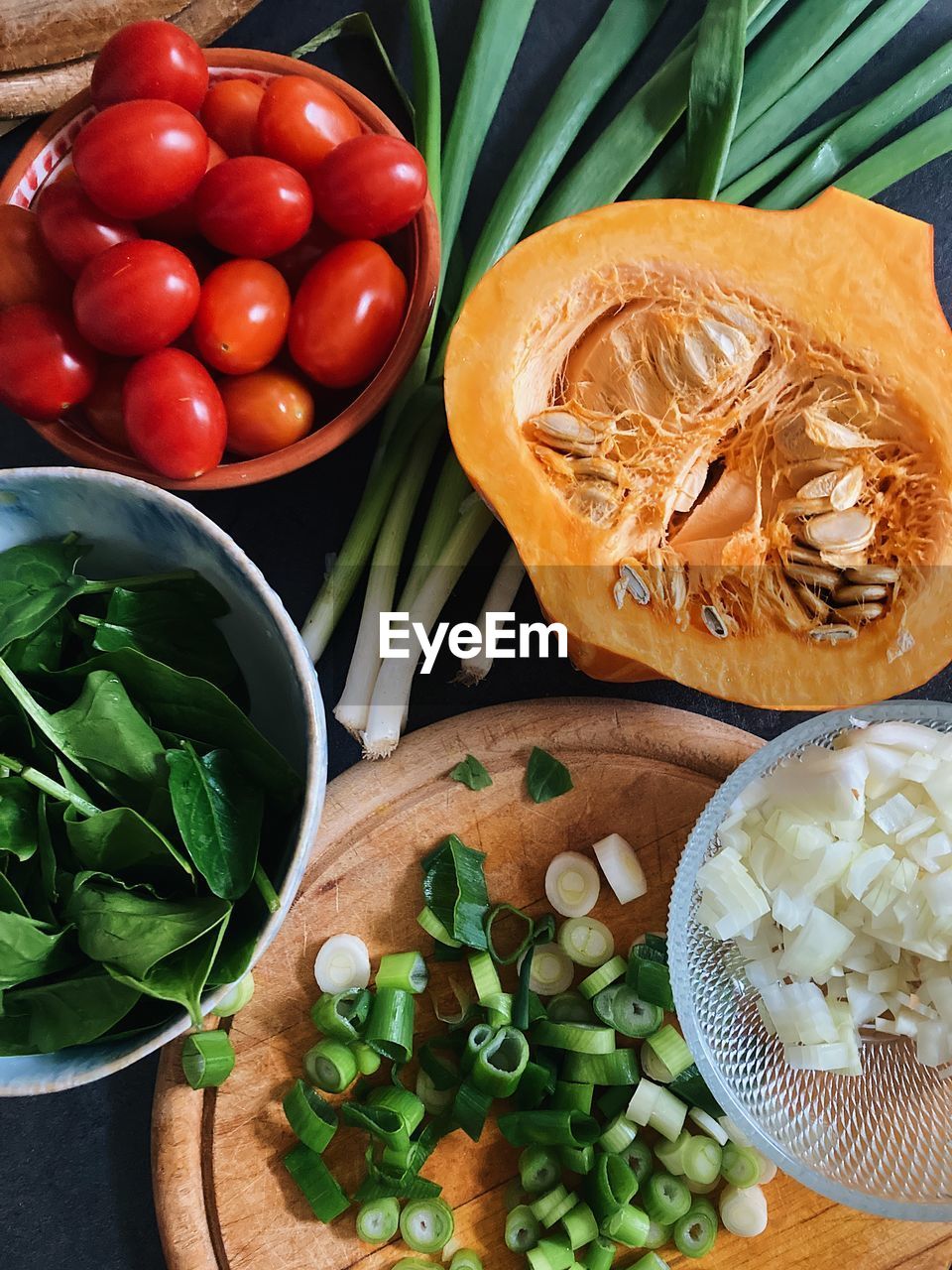 food and drink, food, vegetable, healthy eating, freshness, dish, wellbeing, produce, fruit, high angle view, ingredient, herb, no people, indoors, tomato, directly above, still life, spice, bowl, plant, leaf, onion, cutting board, plant part, table, green, raw food, fast food, organic, garlic