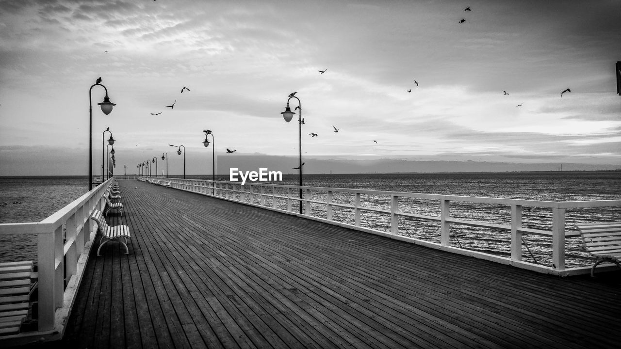 Scenic view of sea against cloudy sky