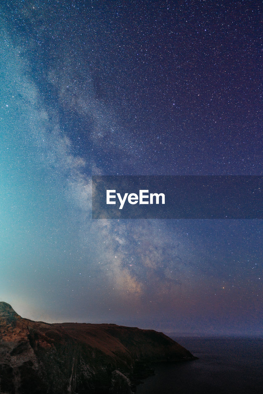 Scenic view of star field against sky at night