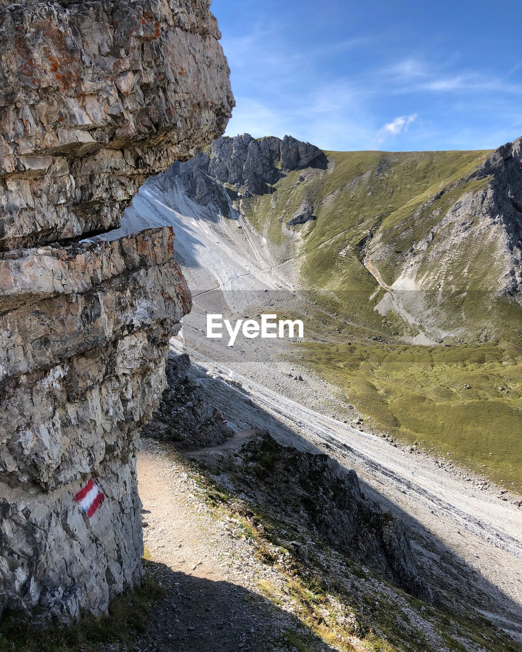 SCENIC VIEW OF ROCKS AND MOUNTAINS AGAINST SKY