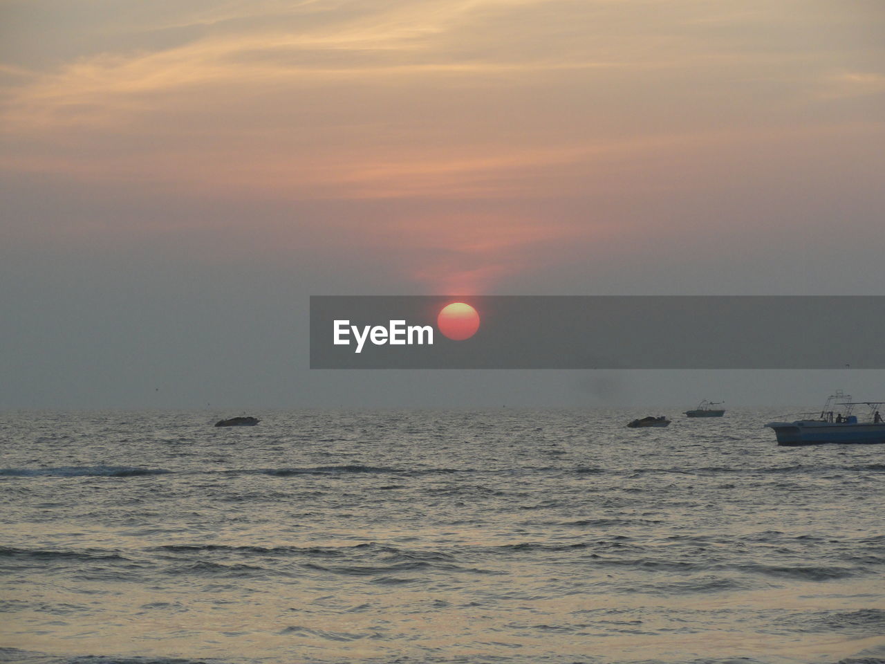 VIEW OF SEA AT SUNSET