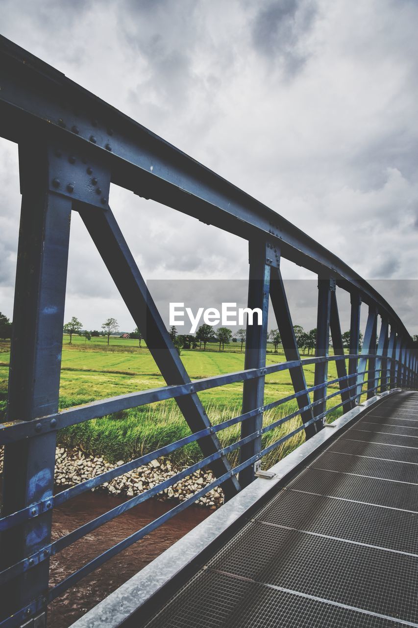 bridge, architecture, transportation, built structure, sky, cloud, overpass, road, nature, city, highway, cable-stayed bridge, no people, transport, day, travel, outdoors, water, travel destinations, landscape, environment, girder bridge, railing, freeway