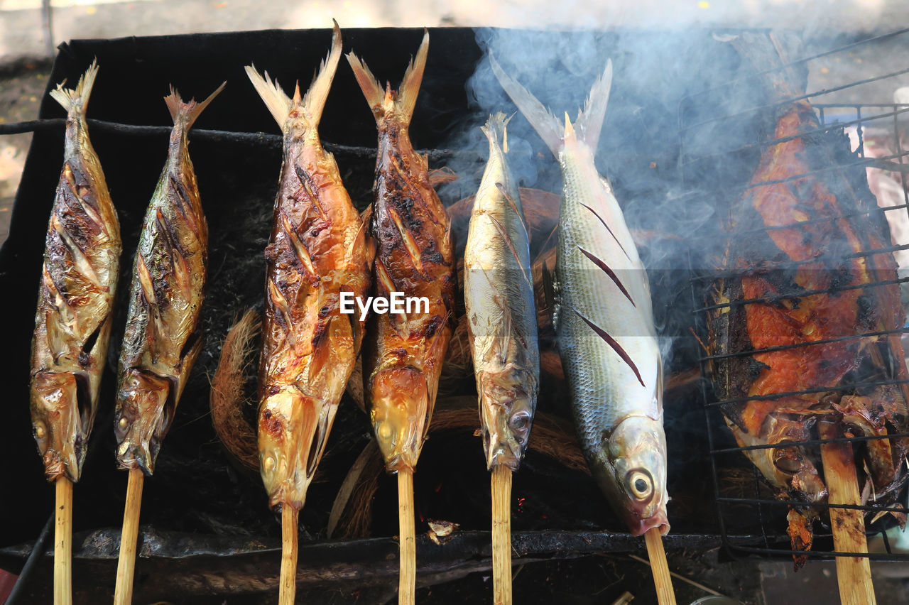 Close-up high angle view of fish on grill