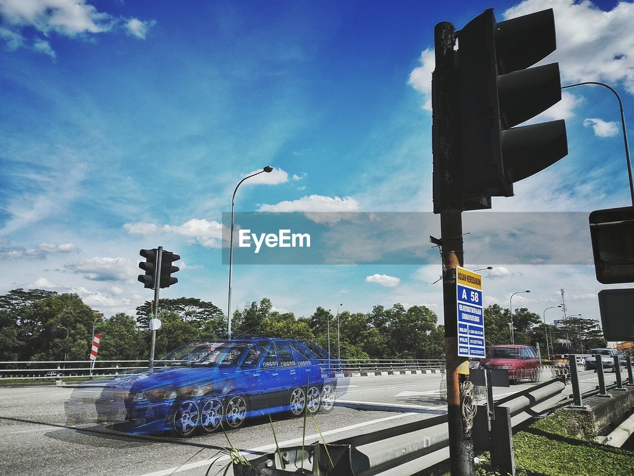 LOW ANGLE VIEW OF ROAD AGAINST SKY