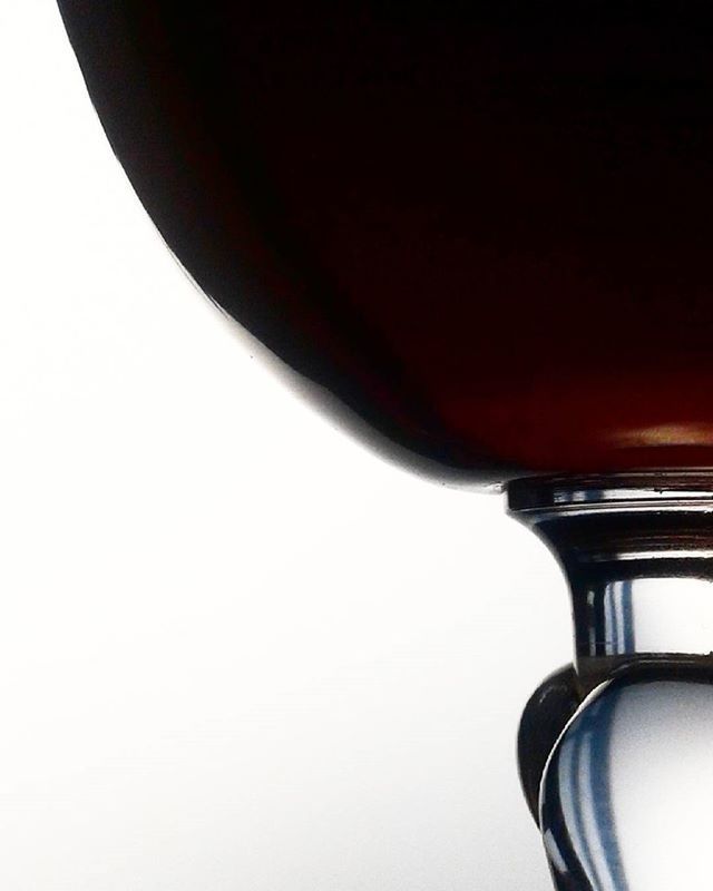 CLOSE-UP OF RED OBJECT OVER WHITE BACKGROUND