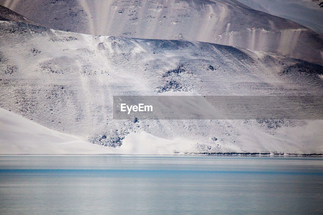 AERIAL VIEW OF SEA AND SNOW