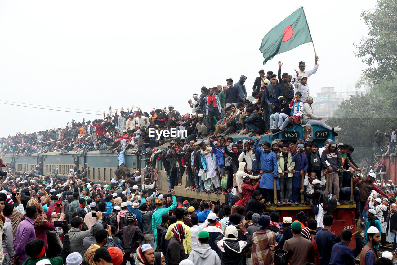 Large number of people are travelling in train. 
