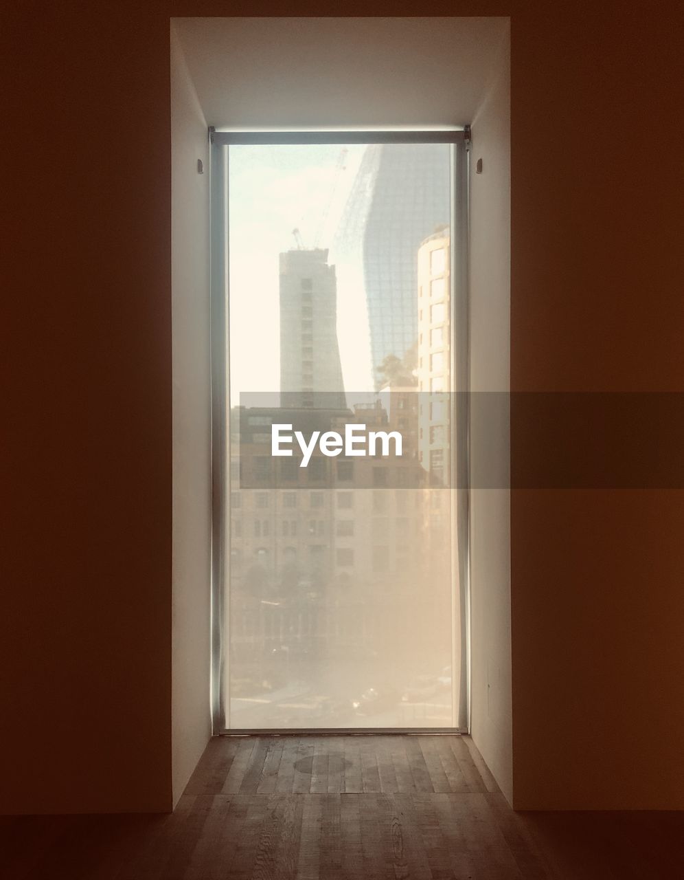 BUILDINGS SEEN THROUGH WINDOW