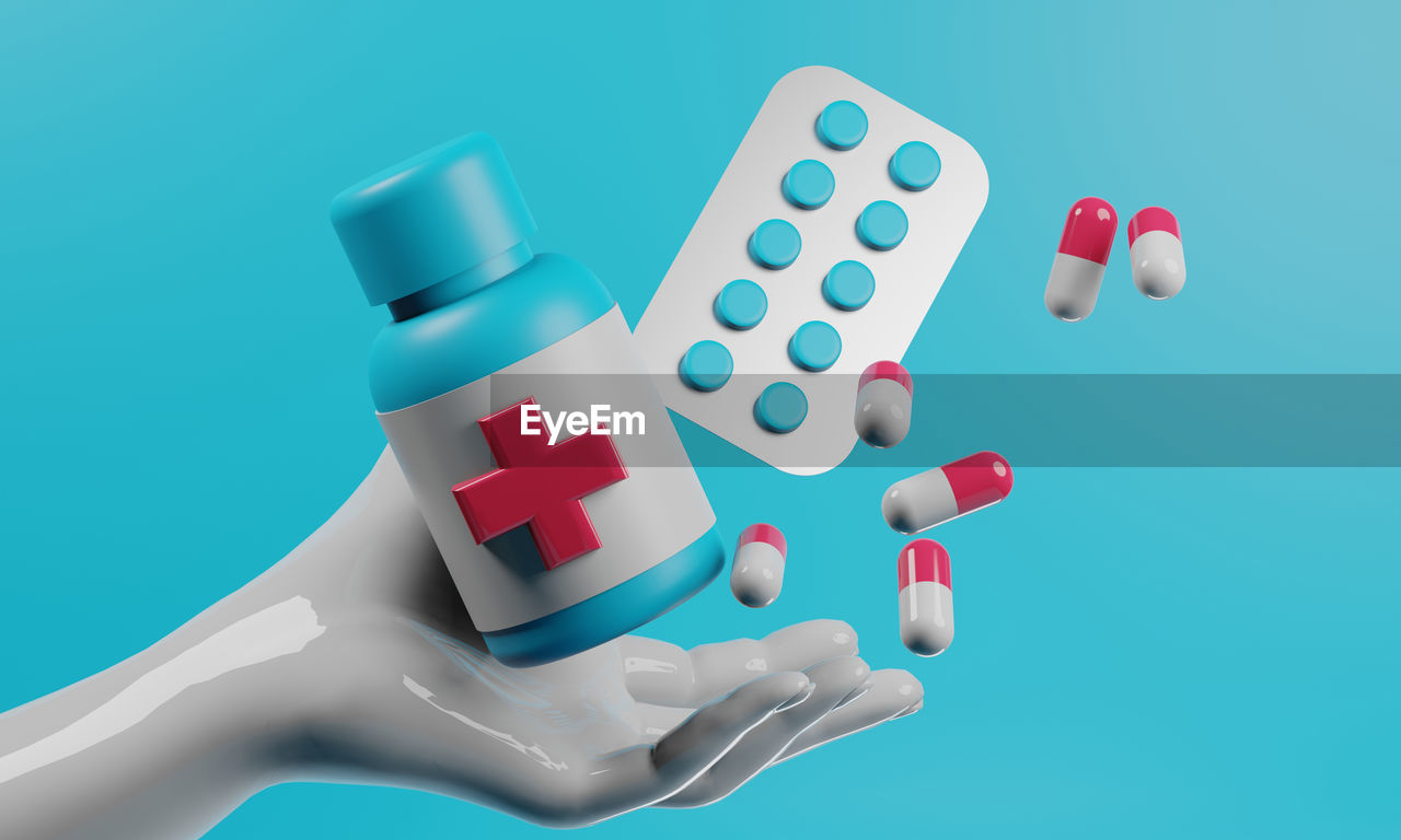 high angle view of pills against blue background