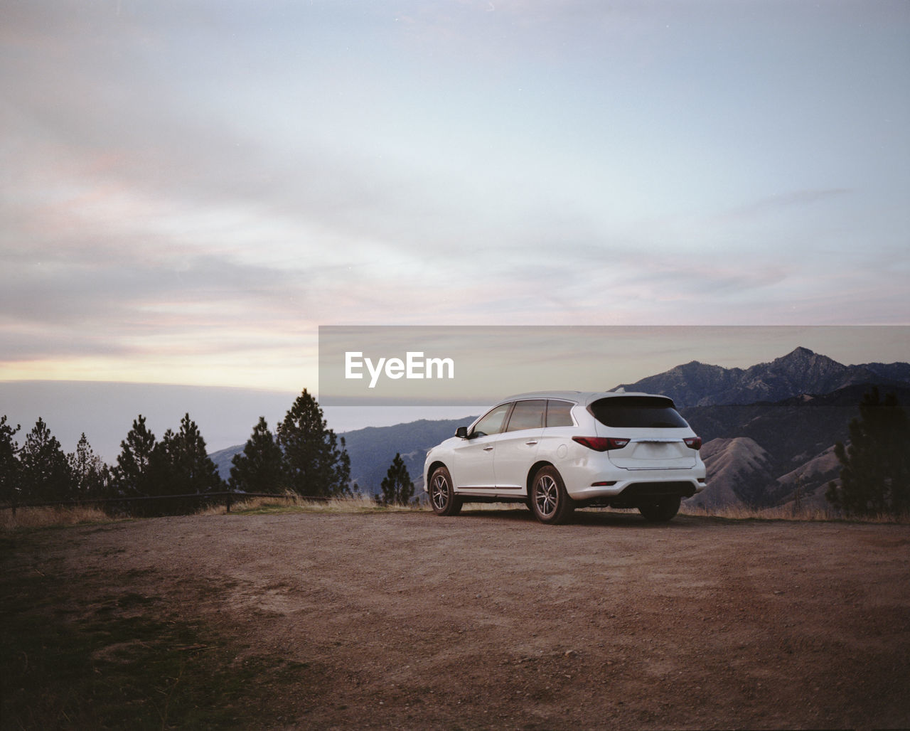 Car parked on hills overlooking big sur coastline