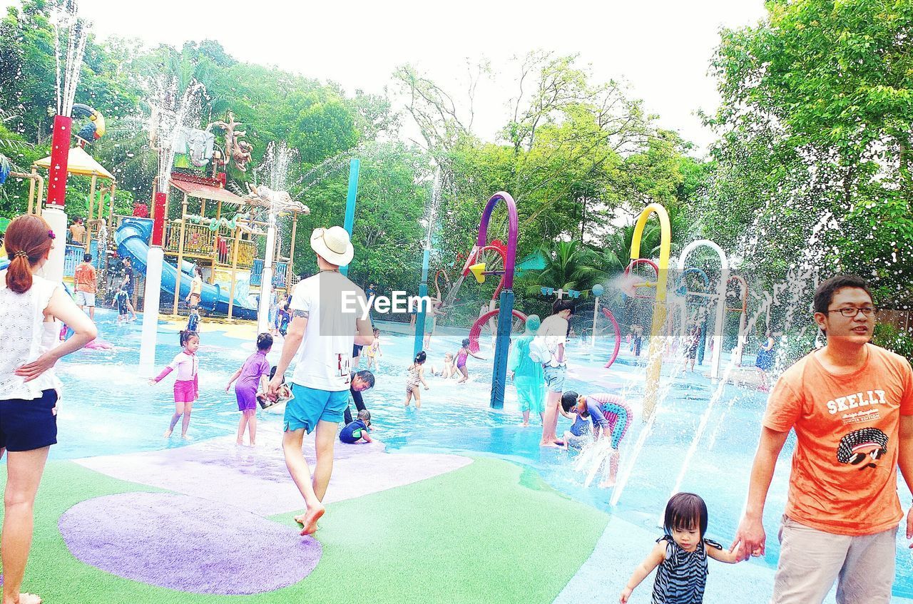 TOURISTS ENJOYING IN WATER