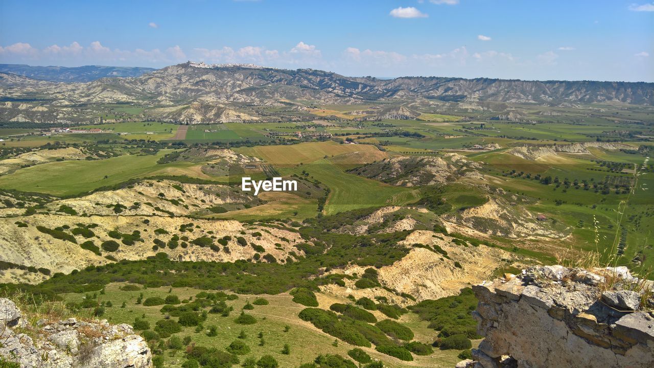 HIGH ANGLE VIEW OF FARM AGAINST SKY