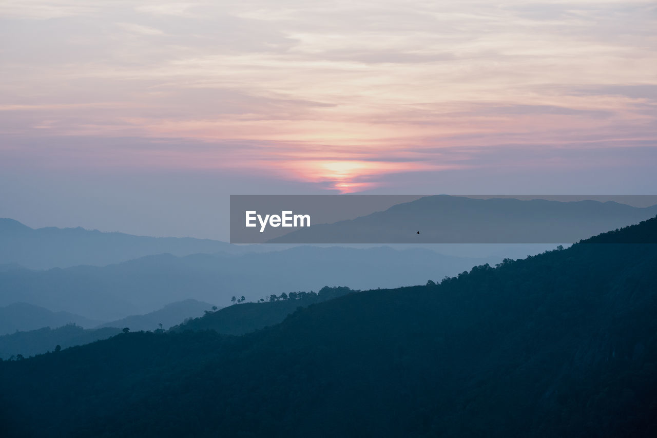 Wide view layer of mountain with sunrise background