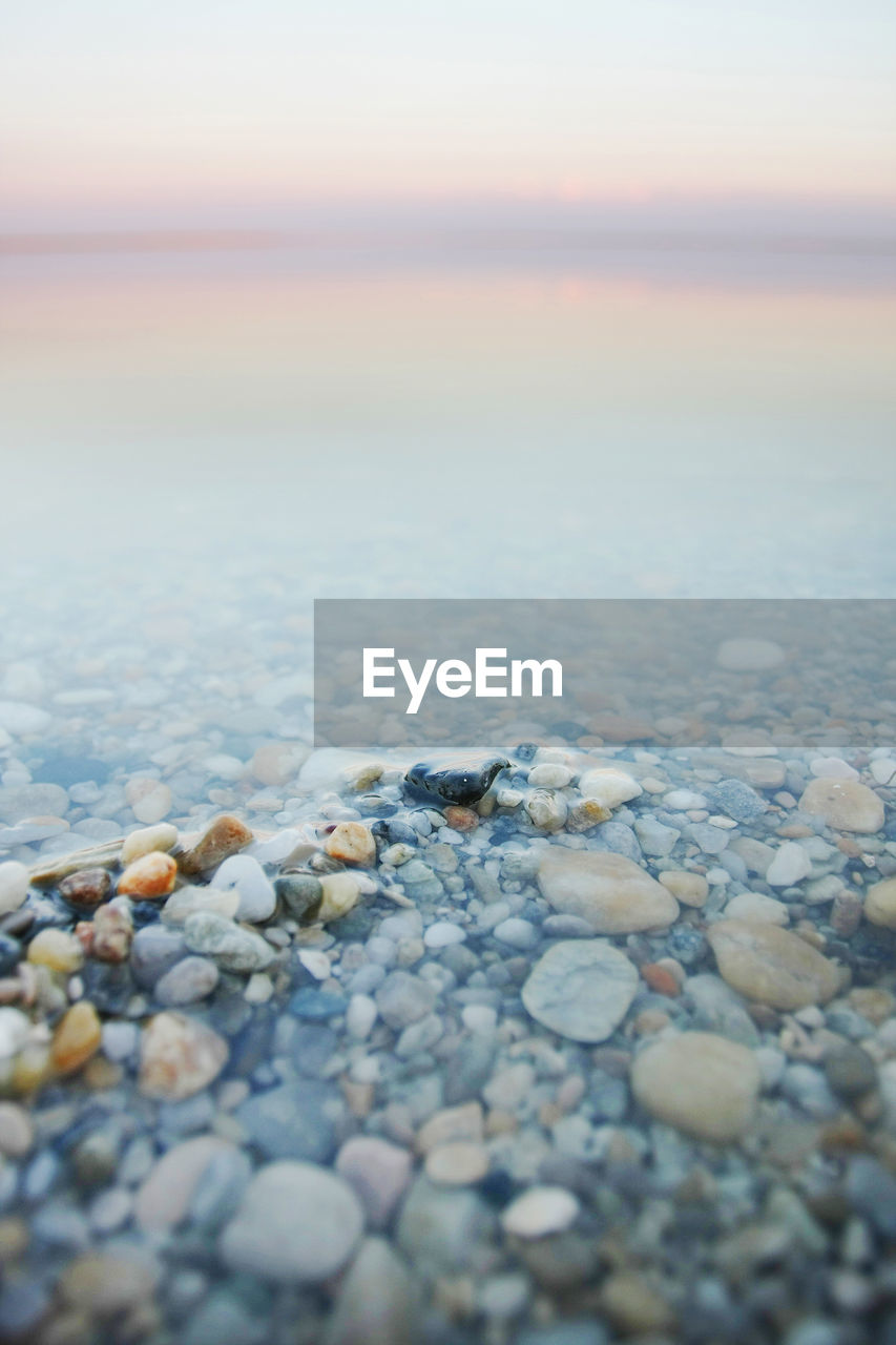 SURFACE LEVEL OF PEBBLES ON SHORE