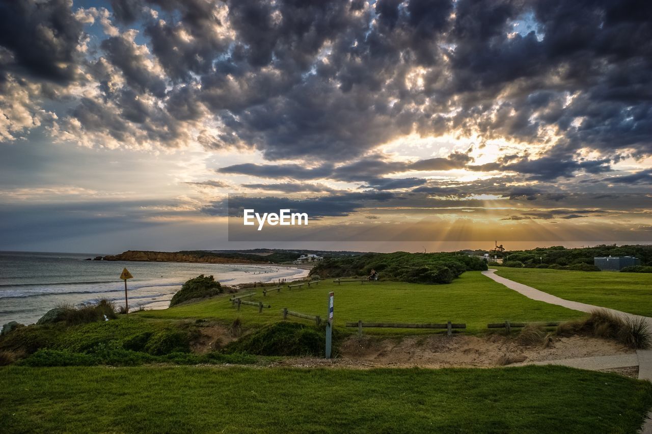 Scenic view of beach against sky during sunset