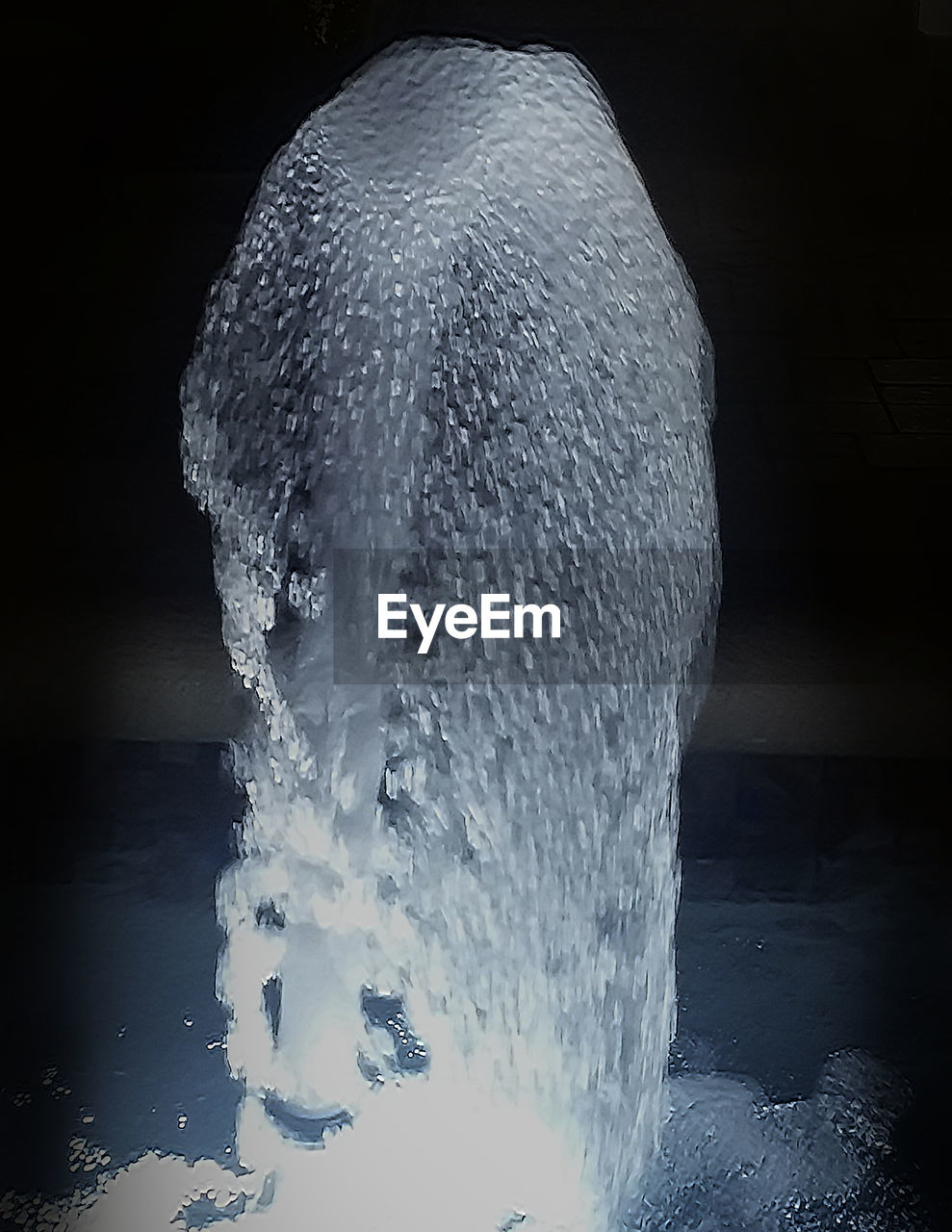 WATER SPLASHING AGAINST BLACK BACKGROUND