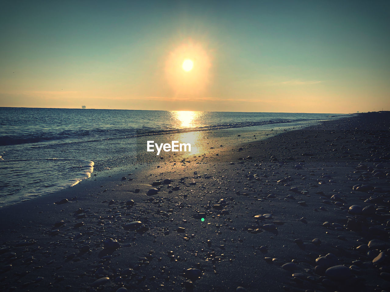 SCENIC VIEW OF SEA DURING SUNSET