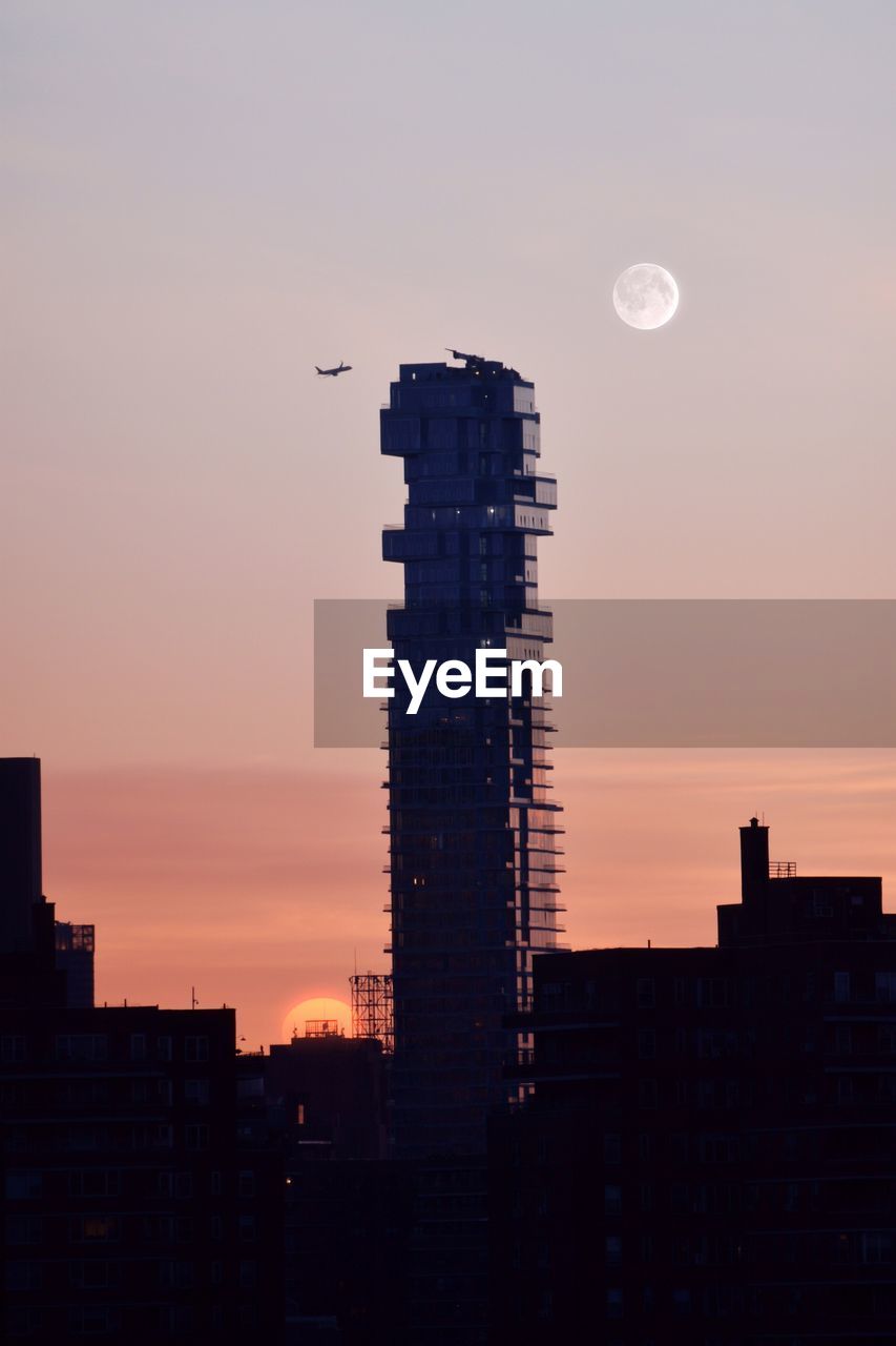 LOW ANGLE VIEW OF SKYSCRAPERS DURING SUNSET