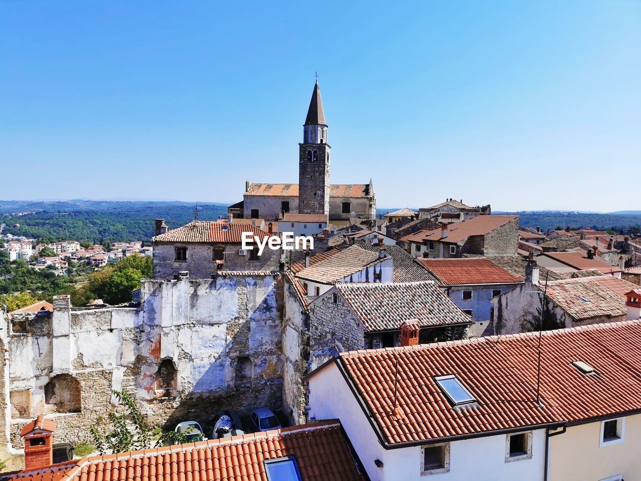 Aerial view of townscape against clear blue sky