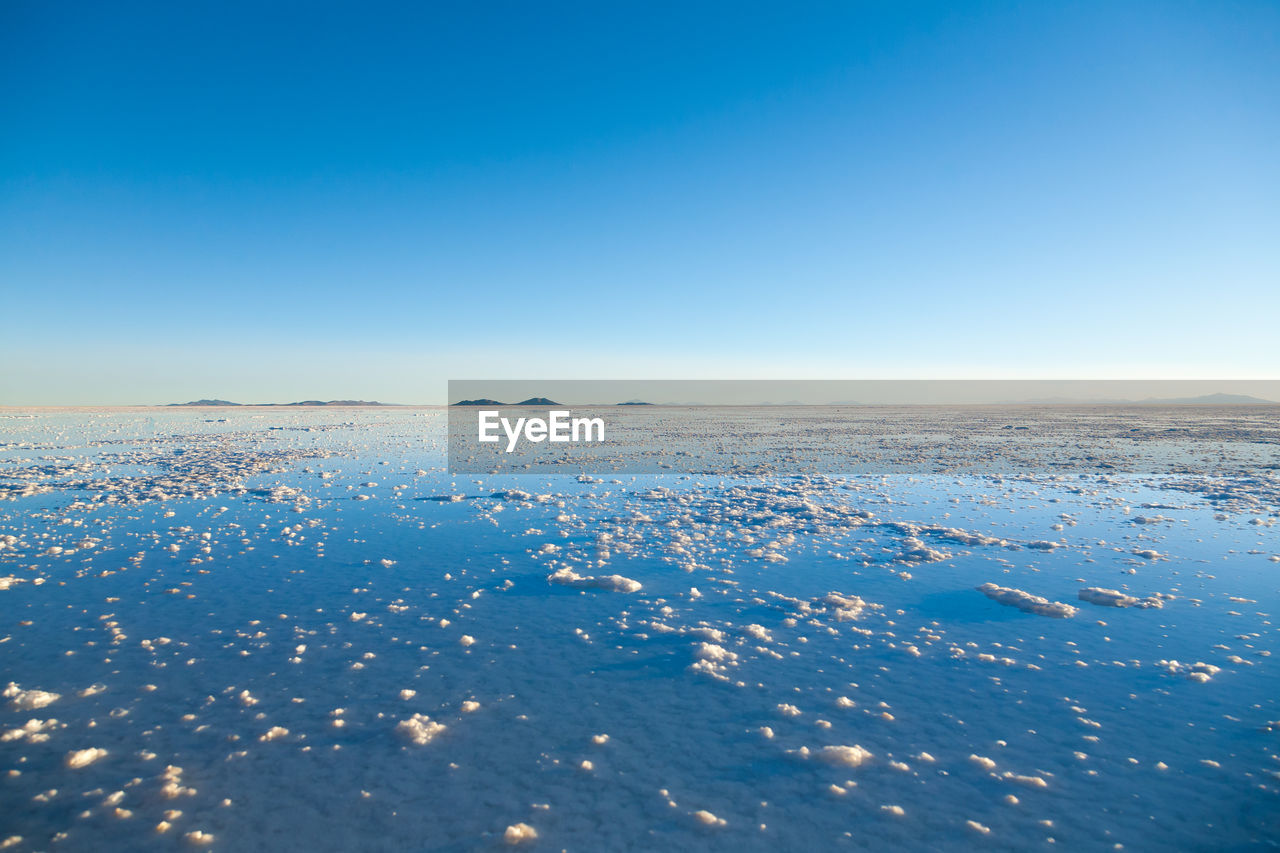 SCENIC VIEW OF SNOW AGAINST CLEAR BLUE SKY