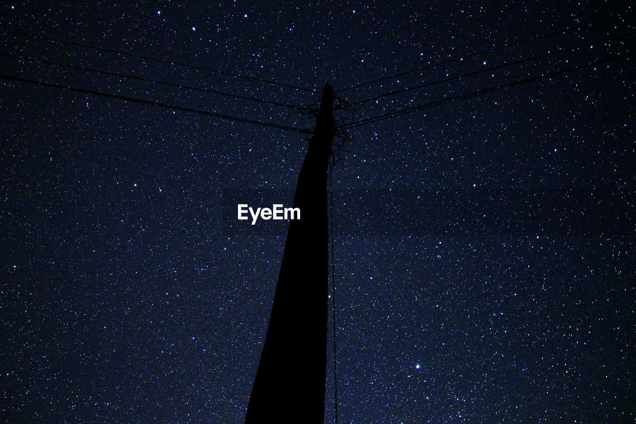 Low angle view of stars against sky at night