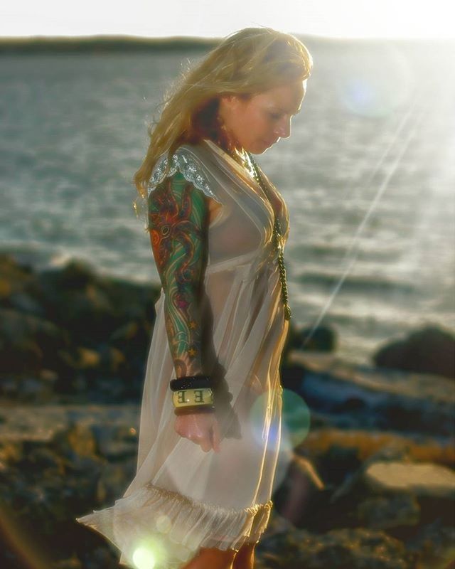 CLOSE-UP OF WOMAN STANDING ON RAILING